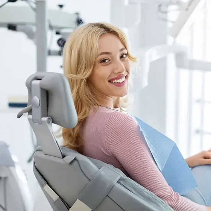 young-woman-smiling-during-exam-705x705